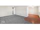Living room with a combination of hardwood and carpet flooring at 3130 Elizabeth St, Indianapolis, IN 46234