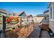 Outdoor entertaining space with a deck, hot tub, and a vintage sign adorning the wooden fence at 320 15Th St, Columbus, IN 47201