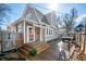 Charming home featuring a backyard deck, hot tub, and stylish outdoor seating perfect for entertaining at 320 15Th St, Columbus, IN 47201