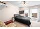 Cozy bedroom with neutral walls, carpet floors, and a comfortable bed facing a window at 320 15Th St, Columbus, IN 47201