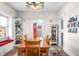 Charming dining room with a wooden table, built-in shelving, and decorative lighting at 320 15Th St, Columbus, IN 47201