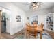 Inviting dining room featuring a wooden table, area rug, stylish light fixture, and built-in shelving at 320 15Th St, Columbus, IN 47201
