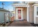 Welcoming entrance with a covered porch, a stylish door, and a vibrant welcome mat for guests at 320 15Th St, Columbus, IN 47201