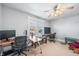 Bright office features great natural light, multiple desks, and a ceiling fan at 320 15Th St, Columbus, IN 47201