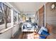 Comfortable screened-in porch featuring a cozy swing and a relaxing rocking chair for enjoying outdoor living at 320 15Th St, Columbus, IN 47201