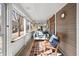 Inviting screened-in porch with comfortable seating, offering a cozy outdoor living space at 320 15Th St, Columbus, IN 47201