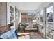 Inviting screened-in porch featuring a comfortable seating area and plenty of natural light at 320 15Th St, Columbus, IN 47201