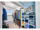 Organized walk-in closet features built-in shelves, ample storage, and natural light at 320 15Th St, Columbus, IN 47201