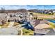 Neighborhood view showcasing well-maintained homes with mature trees and community pond at 4139 Bella Ct, Indianapolis, IN 46237