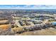 Scenic aerial view of a community with winding roads, multiple ponds, and lush greenery at 4139 Bella Ct, Indianapolis, IN 46237