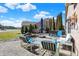 Paver patio with elegant outdoor furniture, a rock feature, and manicured landscaping at 4139 Bella Ct, Indianapolis, IN 46237