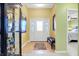 Inviting entryway featuring tile flooring, decorative front door, and a view into a bedroom on the other side of the hall at 4139 Bella Ct, Indianapolis, IN 46237