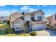 Charming two-story home with brick accents, a two-car garage, and manicured landscaping at 4139 Bella Ct, Indianapolis, IN 46237