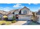 Charming two-story home featuring a brick and siding exterior with an attached two-car garage and well-manicured landscaping at 4139 Bella Ct, Indianapolis, IN 46237