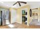 Kitchen area with stainless steel refrigerator and easy access to the laundry room and the stairs at 4139 Bella Ct, Indianapolis, IN 46237