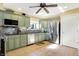 Bright kitchen featuring stainless steel appliances, tile flooring, custom cabinetry, and ample counter space at 4139 Bella Ct, Indianapolis, IN 46237