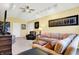 Open living room with vaulted ceiling, ceiling fan, recessed lights and comfortable seating at 4139 Bella Ct, Indianapolis, IN 46237