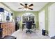 Bright office featuring an arched window, ceiling fan, and built-in wooden dresser drawers at 4139 Bella Ct, Indianapolis, IN 46237
