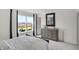 Bedroom with a large window letting in plenty of natural light, complemented by a gray wood dresser at 4435 Laughter Ln, Indianapolis, IN 46235