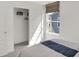 A bedroom boasts a closet with sliding doors and a window with a woven shade allowing natural light at 4435 Laughter Ln, Indianapolis, IN 46235