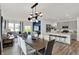 Open concept kitchen, dining, and living room with an abundance of natural light at 4435 Laughter Ln, Indianapolis, IN 46235