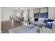 Open-concept living and dining area with modern lighting, stylish decor, and hardwood floors at 4435 Laughter Ln, Indianapolis, IN 46235