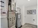 Mechanical room showcasing the furnace and hot water heater at 4435 Laughter Ln, Indianapolis, IN 46235
