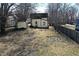 View of backyard, with lawn and detached garage at 462 W Broadway St, Greenwood, IN 46142