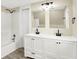 Bathroom featuring a dual sink vanity, toilet, and bathtub at 462 W Broadway St, Greenwood, IN 46142