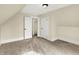 Bedroom featuring neutral walls, dormered ceilings, and multiple doors at 462 W Broadway St, Greenwood, IN 46142