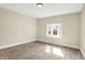 Neutral bedroom featuring a bay window and neutral carpet at 462 W Broadway St, Greenwood, IN 46142