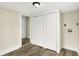 Bedroom with modern wood floors, fresh neutral paint, and a closet with bi-fold doors at 462 W Broadway St, Greenwood, IN 46142