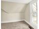 Inviting bedroom with neutral walls and carpet, featuring a window overlooking the outdoors at 462 W Broadway St, Greenwood, IN 46142