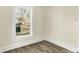 Bedroom with a window looking out to the yard and updated trim at 462 W Broadway St, Greenwood, IN 46142