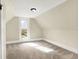 Bedroom featuring neutral walls, dormered ceilings, and a window letting in natural light at 462 W Broadway St, Greenwood, IN 46142