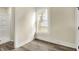 Bedroom featuring new flooring, neutral paint, natural light, and access to a modern bathroom at 462 W Broadway St, Greenwood, IN 46142