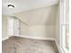 Bedroom with neutral walls and carpet, featuring a doorway and sunlit window at 462 W Broadway St, Greenwood, IN 46142