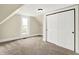 Bedroom featuring dormered ceilings, a closet, and a window letting in natural light at 462 W Broadway St, Greenwood, IN 46142