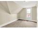 Carpeted bedroom featuring a window and neutral wall color creating a relaxing atmosphere at 462 W Broadway St, Greenwood, IN 46142