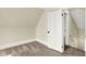 Bedroom featuring neutral walls, dormered ceilings, and a view of the hallway at 462 W Broadway St, Greenwood, IN 46142