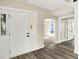 Inviting entryway featuring new gray flooring, white trim, and an arched doorway at 462 W Broadway St, Greenwood, IN 46142