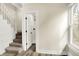 Hallway with staircase and access to a bathroom at 462 W Broadway St, Greenwood, IN 46142