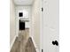 Hallway with a view of the kitchen with stainless appliances at 462 W Broadway St, Greenwood, IN 46142