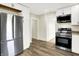 Modern kitchen features stainless steel appliances, granite countertops, and wood-look flooring at 462 W Broadway St, Greenwood, IN 46142