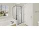 Bright bathroom featuring a glass enclosed shower and soaking tub at 4722 Common View Cir, Indianapolis, IN 46220