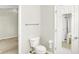 Bright bathroom features a toilet, towel bar, and partial view of a shower through the door mirror at 4722 Common View Cir, Indianapolis, IN 46220