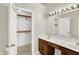 Bathroom with double sinks, large mirror, and walk-in closet at 4722 Common View Cir, Indianapolis, IN 46220