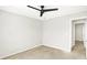 Neutral bedroom with a ceiling fan and a doorway leading to a hall at 4722 Common View Cir, Indianapolis, IN 46220