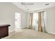 Spacious bedroom with natural light, neutral walls, ceiling fan, dark brown cabinet and an inviting layout at 4722 Common View Cir, Indianapolis, IN 46220