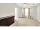 Spacious bedroom with natural light, neutral walls, ceiling fan, dark brown cabinet and an inviting layout at 4722 Common View Cir, Indianapolis, IN 46220